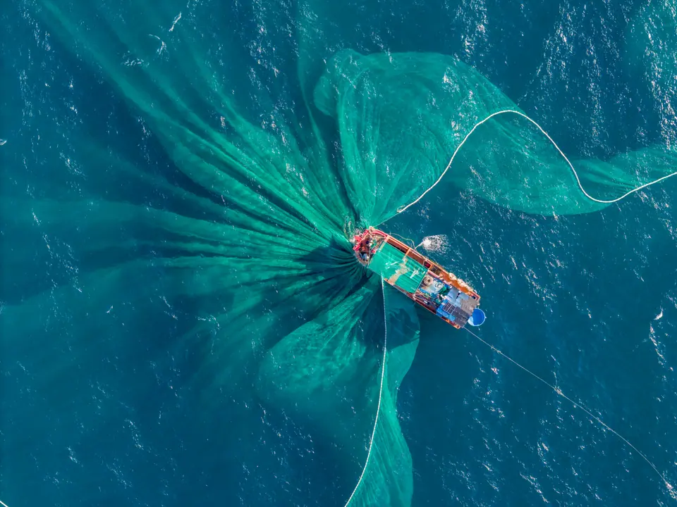 Aerial view of traditional wooden boat and fishermen are fishing anchovies in Yen Island, Phu Yen province, Vietnam