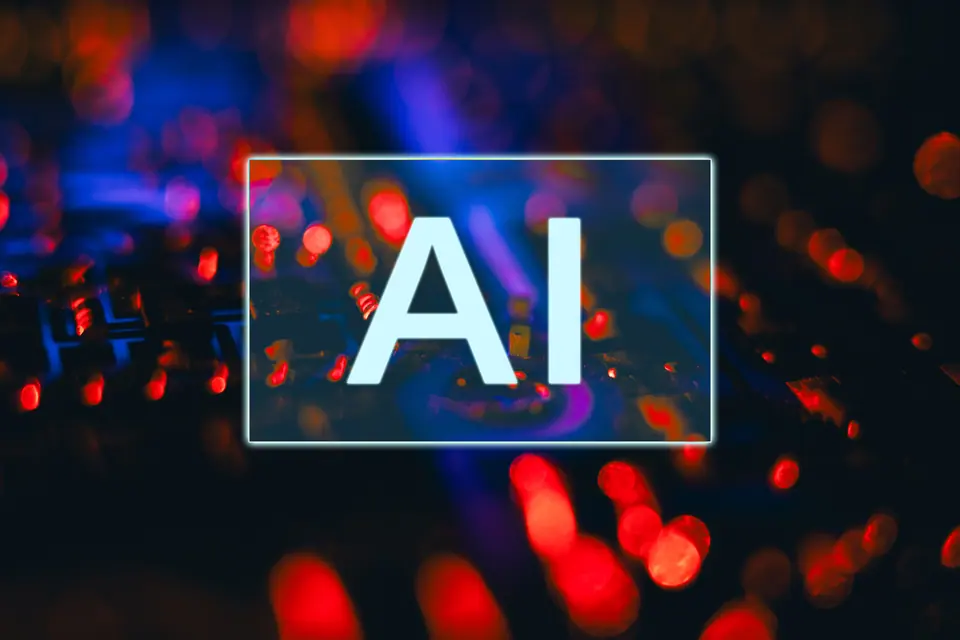 AI letters displayed above a blurred circuit board with abstract red and blue lights