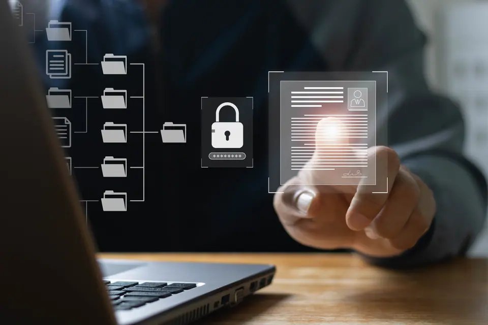 Business people use laptops to access information in online documents