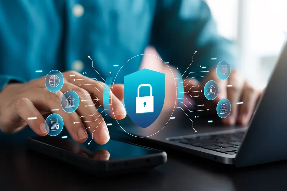 Cyber ​​security and data protection, businessman using laptop and tablet Internet network security system, protecting business financial transaction…