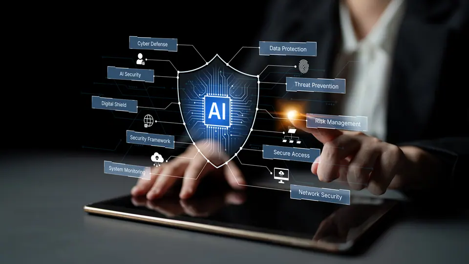 Hands interacting with a tablet display showcasing an AI shield for data protection and cyber defense, emphasizing innovative technology in security…
