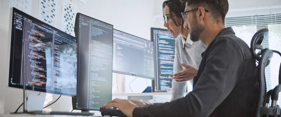 Hispanic Latin American couple, software engineer developer use computer, work on program coding together at home office