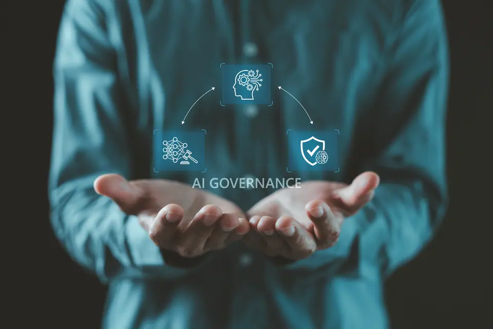 Justice gavel, security shield, and AI network representing AI law and ethical governance, Hands holding a glowing digital hologram, Technology future,…