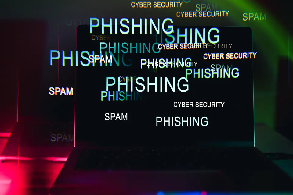 Laptop screen showing digital text about online fraud and data protection