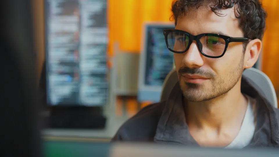 Professional engineer typing AI prompts on laptop for creative technology and artificial intelligence development