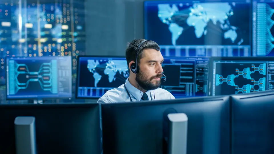 System control room dispatcher talks into headset