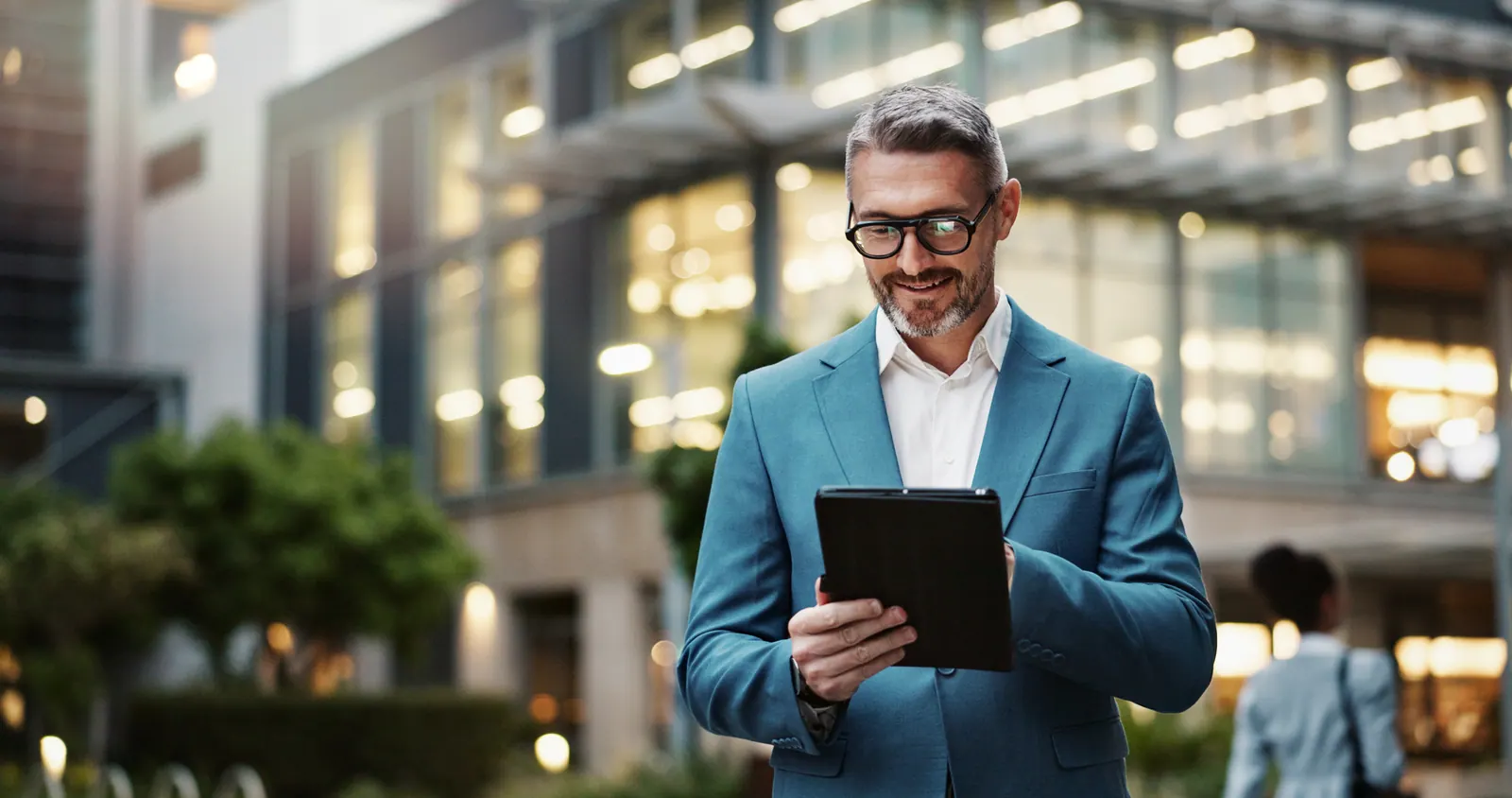Professional reviewing a web application on a tablet